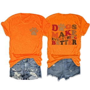 Close-up of Dogs Make Everything Better graphic print on casual orange t-shirt back