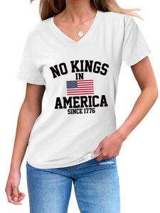 Detail of V-neck white T-shirt featuring No Kings In America 1776 print and US flag