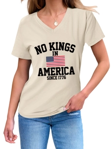 Close-up of V-neck tee featuring NO KINGS IN AMERICA print and US flag detail