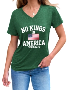 Detail of V-neck dark green T-shirt with No Kings In America 1776 slogan and flag