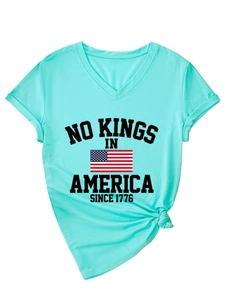 Detail of mint green V-neck T-shirt showing rolled sleeves and side knot design feature