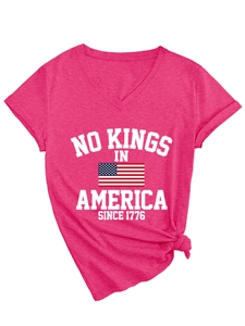 Detail of V-neck T-shirt showing No Kings In America 1776 print and flag