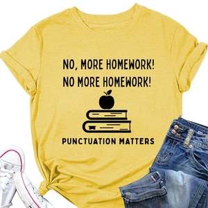 Flat lay of mustard yellow t-shirt with book graphic, paired with sneakers and jeans
