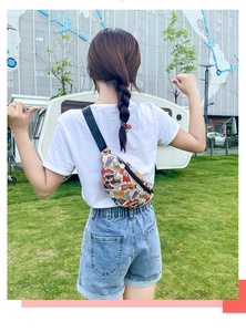 Outdoor shot of stylish canvas crossbody bag with colorful shoe print for women