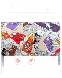 Detail of canvas waist bag fabric featuring colorful sneaker pattern and woven texture