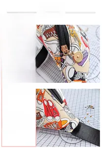 Detailed macro shot of textured hardware zipper and fine stitching on a printed waist bag