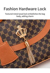 Detailed macro of golden crown lock and metal tassel on a brown patterned crossbody bag