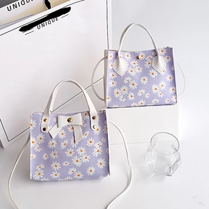 Sac à main violet à imprimé marguerites avec nœud papillon et bandoulière amovible
