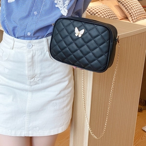 Black quilted PU leather crossbody bag with golden chain and butterfly charm detail