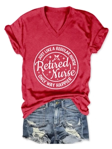Flat lay of a red V-neck T-shirt with Retired Nurse print and ripped denim shorts