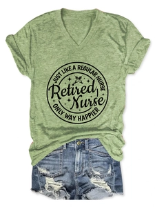Detail of V-neck green T-shirt with Retired Nurse print and ripped denim shorts