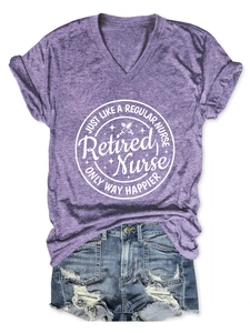 Detail view of a purple V-neck short-sleeved Retired Nurse t-shirt with denim shorts