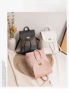 Detail view of mini PU leather backpacks with vintage print, metal clasp and drawstring