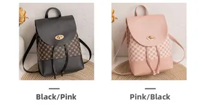 Detail of mini backpacks in black and pink with gold lock and monogram print