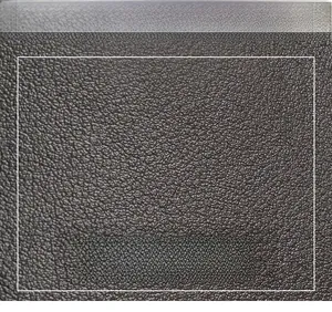 Macro shot of dark brown lychee pattern leather showing fine texture and supple finish