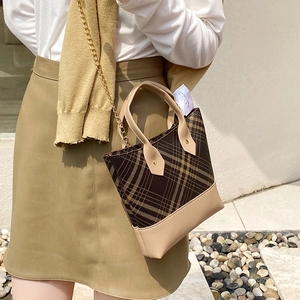 Vintage checkered handbag with beige leather trim and gold chain strap for women