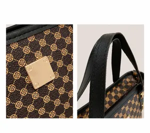 Detail of printed bucket bag with gold square hardware and leather handle textures