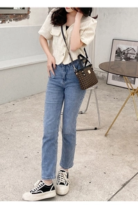 Chic model style featuring a brown checkered bucket bag and tweed jacket outfit