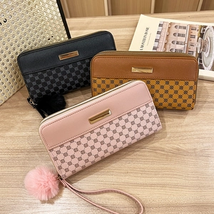 Women's long floral print wallets in black, brown, and pink with gold metal accents