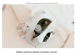 Detailed interior of white quilted mini backpack showing capacity for daily cosmetics