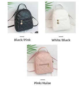 Detail of quilted mini backpack with gold circular zip pendant and front pocket detail