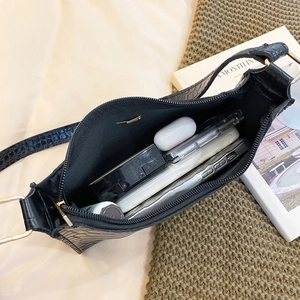 Elegant black crocodile pattern underarm bag with gold hardware and spacious interior