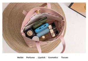 Pink quilted tote bag interior view showing large capacity for wallet and cosmetics