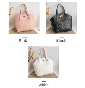 Quilted handbags in pink, black, and white featuring metallic twist-lock and top handles