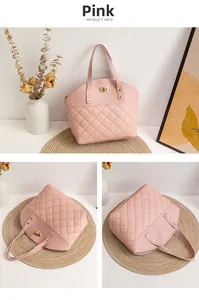Detail of pink quilted tote bag with gold twist lock and dual handle structure