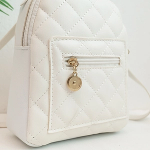 Minimalist beige quilted PU leather backpack with gold zipper and diamond stitch detail