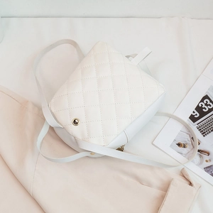 White quilted mini backpack for women made of premium faux leather with gold eyelet detail