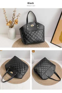 Detail of black quilted leather tote bag featuring gold fish-mouth lock and sturdy handles