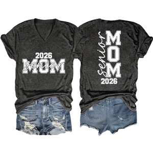 Flat lay of gray V-neck T-shirt with 2026 Senior Mom print and denim shorts set
