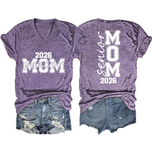 Flat lay of purple marble V-neck T-shirt with 2026 Senior MOM text and ripped denim shorts