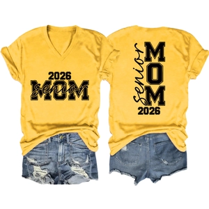Flat lay of yellow V-neck 2026 Senior MOM t-shirt with ripped denim shorts