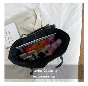 Macro view of the spacious internal capacity showing organized daily essentials in a tote bag