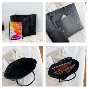 Detail showing spacious interior of black quilted tote bag holding daily essentials