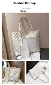 Detailed view of white quilted tote bag with matching pouch and golden magnetic closure