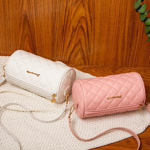 Quilted cylinder crossbody bag for women in white and pink faux leather with gold accents