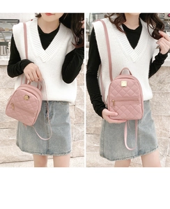 Pink quilted mini backpack with gold metal plate detail and adjustable straps for women