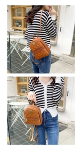 Close-up of brown quilted faux leather mini backpack with metal logo and zipper detail