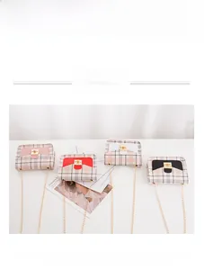 Checkered crossbody bag detail featuring pink, red, white, and black color block designs