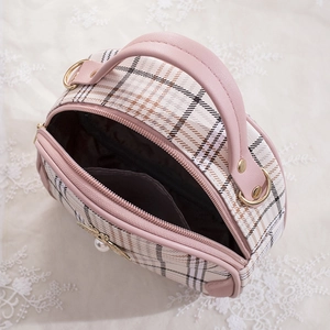 Women's plaid semi-round handbag with pink trim and pearl bee ornament shown from top view