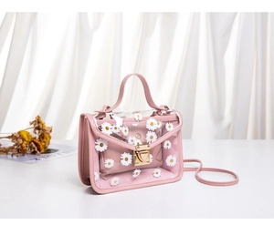 Detail of pink transparent jelly bag with daisy prints and a matching inner pouch