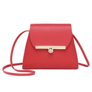 Red minimalist faux leather crossbody bag with golden hardware lock and flap design