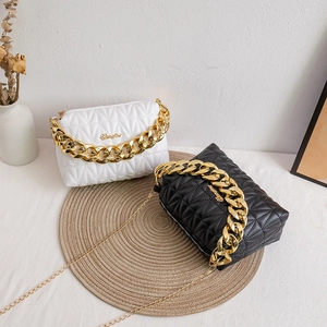 Diamond quilted PU leather handbag with chunky gold chain handles in black and white