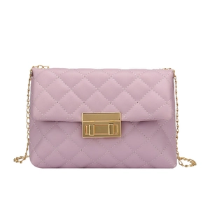 Lavender purple quilted crossbody bag with gold chain strap and metal lock closure