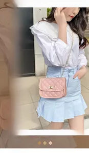 Pink quilted square crossbody bag with gold chain strap and twist lock detail