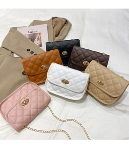 Multiple colors of quilted mini crossbody bags with gold chain straps and twist locks