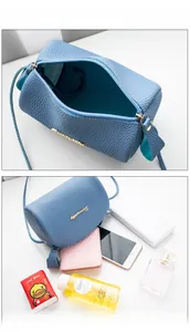 Detailed internal capacity of blue lychee pattern cylindrical crossbody phone bag